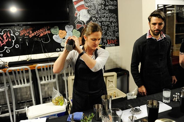 Rachel Cope mixes cocktails during a pop-up dinner at Dunlap Codding in Oklahoma City, Tuesday, March 3, 2015. - GARETT FISBECK