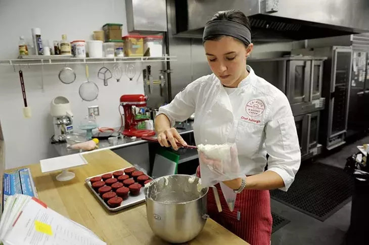 Ashleigh Barnett makes red velvet cupcakes at Crimson & Whipped Cream in Norman, Tuesday, July 21, 2015. - GARETT FISBECK