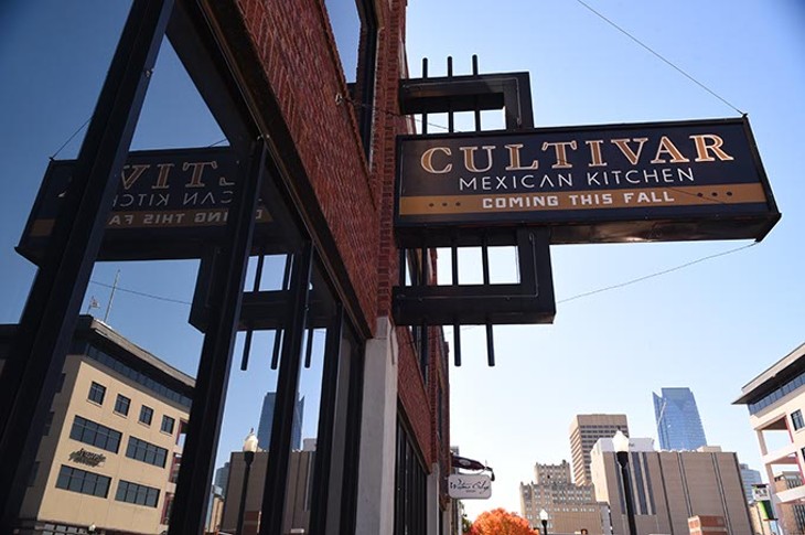 New sign of things to come, Cultivar Mixican Kitchen on Broadway Avenue in with Downtown skyline, 11-12-15. - MARK HANCOCK