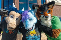 Oklacon furry convention participants from left, Kobalt Silverstar is Mark Franks, Misora is Rachel Swyear, and Zaf is Zachary McWilliams, on a street corner recently in Moore Oklahoma.  mh
