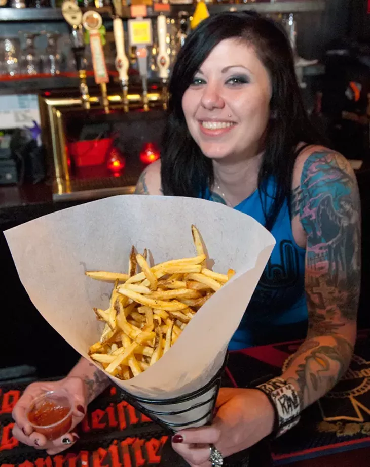 Staff member Jolie Foster with Drunken Fry's belgian fries and sauce. (Mark Hancock)