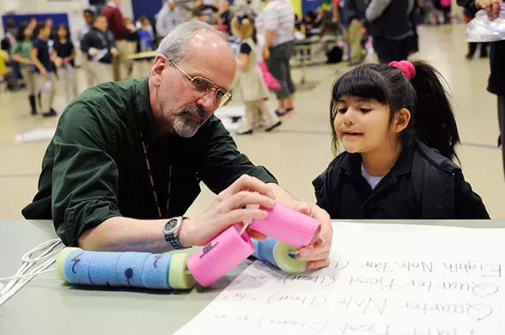 Larry Spitzer teaches Citlali Perez, 5, how to count music at Coolidge Elementary in Oklahoma City, Thursday, Feb. 19, 2015. - GARETT FISBECK
