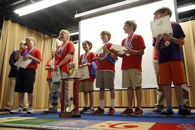 Cleveland Elementary's Odyssey of Mind team, Bobby Cochrane, Jordan Keast, Ryan McLaughlin, Drew Marshall, Noah Reid, and Ian Oswald receive their trophy for placing first in the world finals, Friday, May 29, 2015. The team shared stories from their trip. - GARETT FISBECK