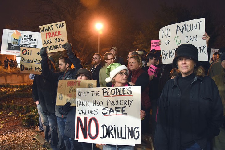 Protesters outside the public hearing concerning Fracking at Lake Hefner, held in a greenhouse at Will Rogers Park, there were more people outside than in on Dec. 18, 2014. - MARK HANCOCK