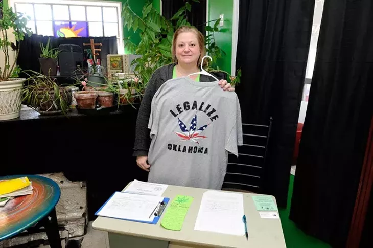 Janine Bradley poses for a photo with a medical marijuana petition at Organics OKC, Thursday, Dec. 3, 2015. - GARETT FISBECK