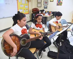 Mariachi students playing a song in Christiaan Osborn's class at Filmore Elementary School in South Oklahoma City, 1-15-16. - MARK HANCOCK