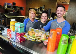 From left, Molly Scott, Taylor Fletcher, and manager Weslee Welch with a bagel sandwich ready to serve at the new Old School Bagel on NW Expressway.Photo/Shannon Cornman - SHANNON CORNMAN