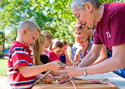 Students get firsthand experience with cultural arts such as finger weaving at the Cherokee Heritage Center during Indian Territory Days. - PROVIDED