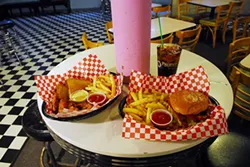 Chicken fingers and fries, left, with a bacon cheesburger and fries, at So Fine. (Mark Hancock)