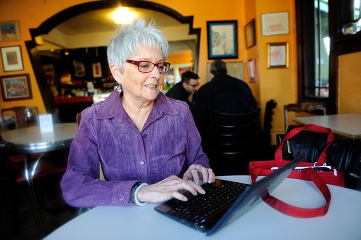 Claudia Swisher on her computer at Red Cup in Oklahoma City, Thursday, Jan. 15, 2015. - GARETT FISBECK