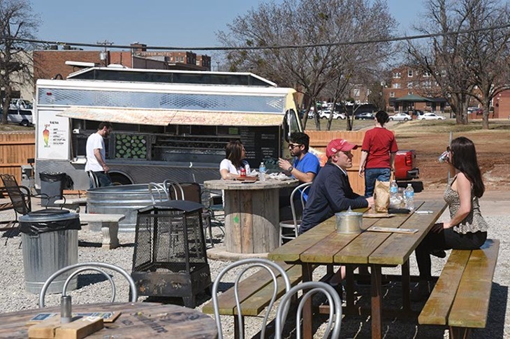 People enjoying a recent warm day at Bleu Garten featuring the Big Truck Taco truck.  mh