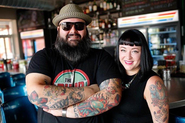 Ian and Hailey McDermid, owners, pose for a photo at the Pump Bar in Oklahoma City, Tuesday, Sept. 8, 2015. - GARETT FISBECK