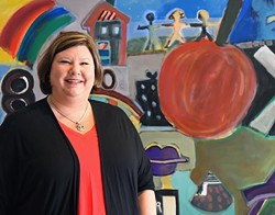 Alicia Priest, president of the Oklahoma Education Association, in front of artwork at the Association offices, 10-8-15. - MARK HANCOCK