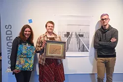 From left, Kerri Shadid, organizer Laura Reese and Ryan Harris, pose with three of their submissions for Passwords, an exhibition by six artists working with text, at IAO on Film Row in OKC, 11-17-15. - MARK HANCOCK