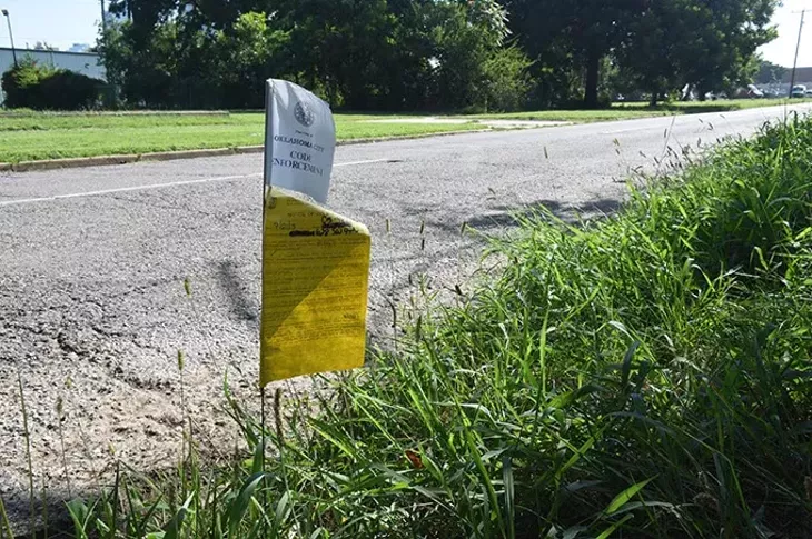 A lot at SW Fourth Street and Lee Avenue was recently pinged with a code violation notice. (Mark Hancock)