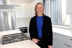 Architect and interior designer Ken Fitzsimmons inside the kitchen of 828 Residence, a project he helped with. (Home featured on this week's cover) (Garett Fisbeck)