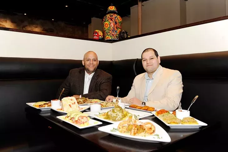 Brothers Arturo and Marco Chavez pose for a photo at the new 1492 New World Latin Cuisine location in Oklahoma City, Friday, Nov. 20, 2015. - GARETT FISBECK