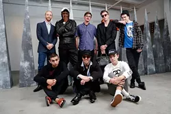 Steven Battles poses for a photo with his crew at SIG Art Gallery in Oklahoma City, Friday, May 15, 2015. - GARETT FISBECK