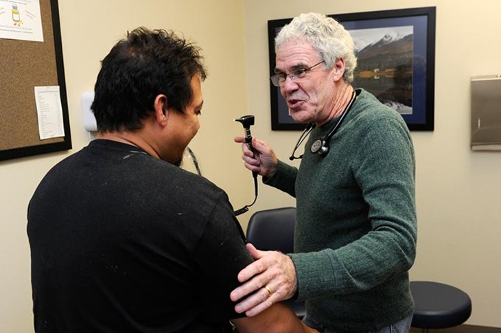 Dr. Fred Loper treats a patient at Good Shepherd in Oklahoma City, Wednesday, Dec. 2, 2015. - GARETT FISBECK