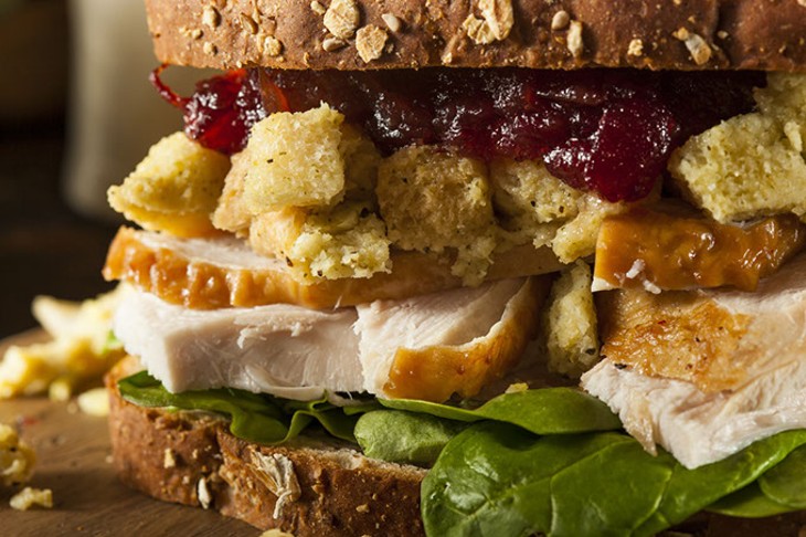 Homemade Leftover Thanksgiving Dinner Turkey Sandwich with Cranberries and Stuffing - BIGSTOCK