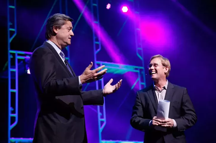 Bart Conner, right, speaks with Pete Delaney during the Creativity World Forum at the Civic Center in Oklahoma City, Tuesday, March 31, 2015. (Photo by Garett Fisbeck)