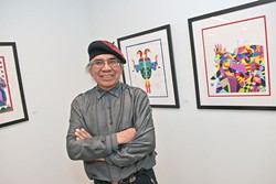 Artist Ben Harjo with an exhibition of his work at the Myriad Botanical Gardens, 1-23-14.  mh