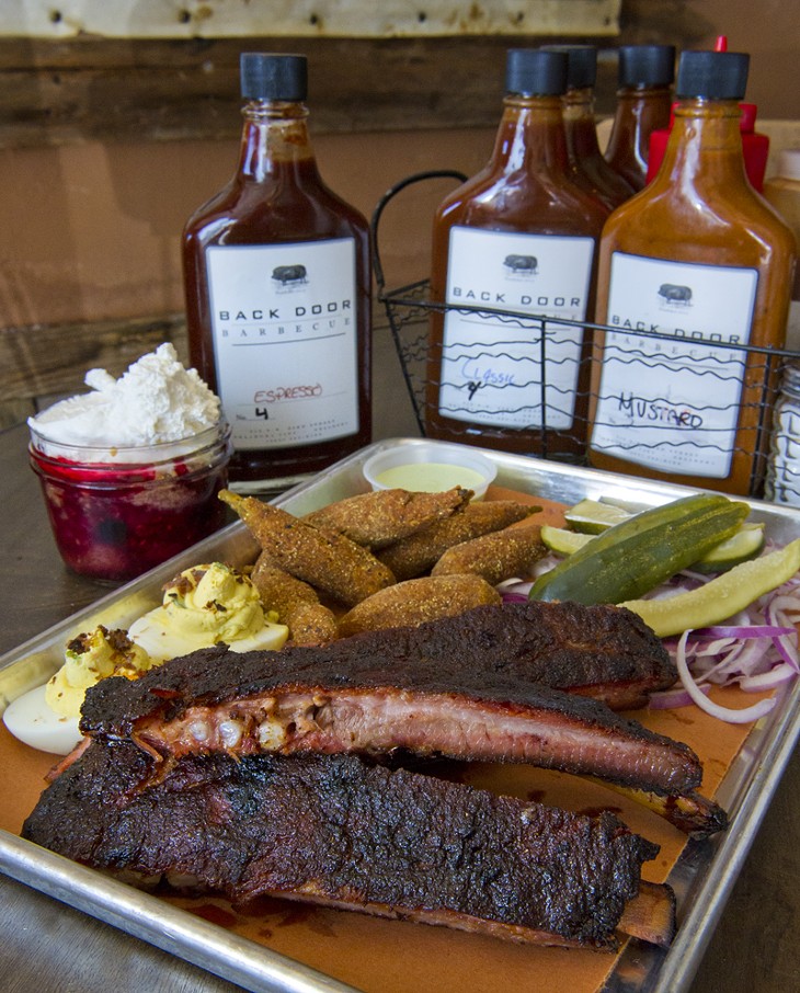 Backdoor BBQ ribs, homemade pickles & onions, fried okra, deviled eggs and mixed fruit cobbler. Housemade BBQ sauces