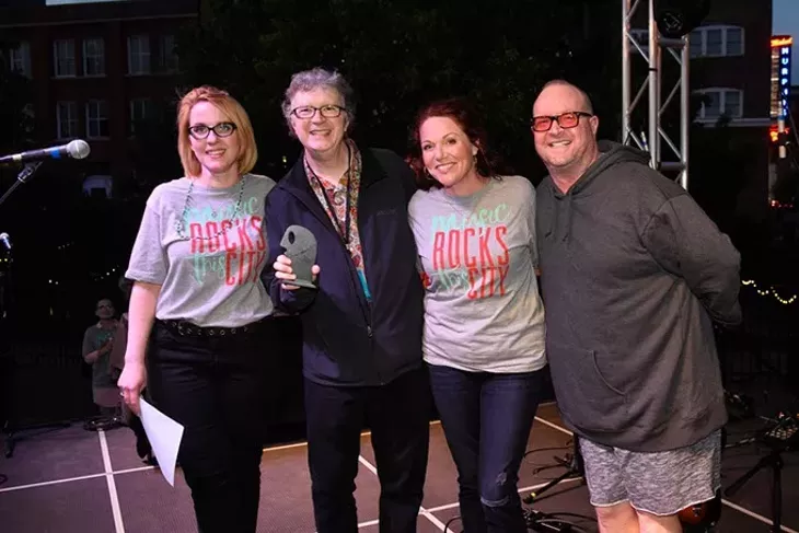 Scott Booker accepts an award for Kaitlin Butts for Best Country during the Oklahoma Gazette Music Awards at Metro Music Fest, Friday, Apri 8, 2016. - GARETT FISBECK