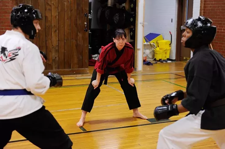 Jennifer Allman watches as Bryce Dalton, 17, left, spars with Nieko Ligons, 17, at Harding Fine Arts Academy in Oklahoma City, Wednesday, Jan. 21, 2015. - GARETT FISBECK