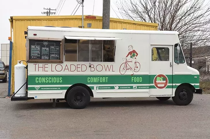 parked across from the Urban Agrarian on Sundays where customers who order prepared meals can pick them up. mh