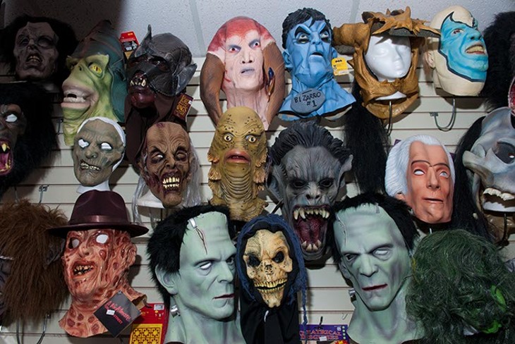 Masks of all shapes and varying levels of terror grace the walls at Costume Fun House (Mark Hancock)