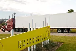 The first of 11 million feed of rope arrives in semis for insallation at Campbell Park, N.W. 11th & Broadway which is directly in front of the site for the new Oklahoma Contemporary Arts Center. Construction of some adjacent offices has already began. 10-2-14. mh
