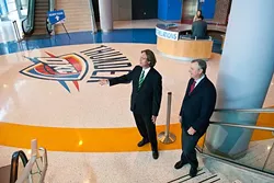 Left, Thomas Thomas Anderson and Tim Linville inside the Chesapeake Energy Arena near the newest entrance. mh