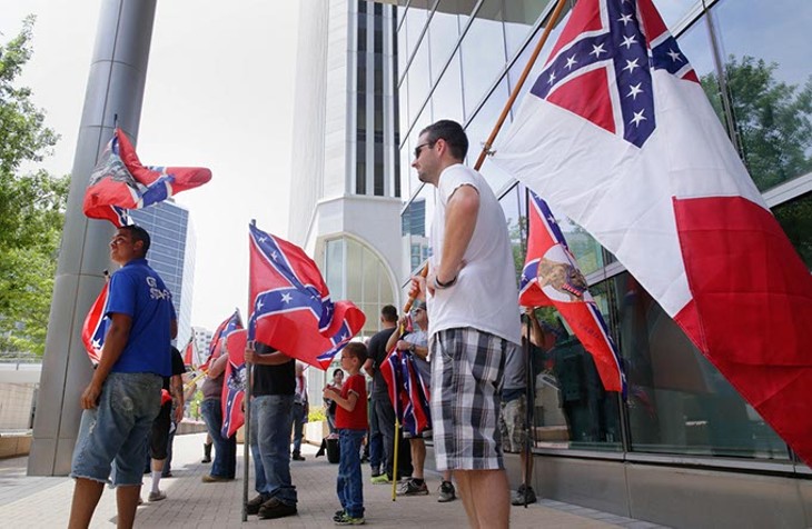 Confederate flag supporters gather in the shade of Tulsa&#146;s City Hall as they hold a rally to support the flag, July 25, 2015. (Photo Michael Wyke / Tulsa World / File / Provided)