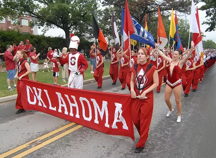 The Pride of Oklahoma marching band marches towards Memorial Stadium for the OU vs Miami football game, 9-8-2007. - MARK HANCOCK