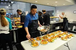 Kevin Lee preps lunch at WestTown day shelter in Oklahoma City, Tuesday, March 24, 2014. - GARETT FISBECK