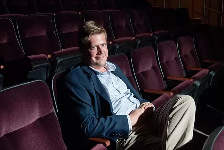 New film curator Michael Anderson seated in the Noble Theater at the OKC Museum of Art. mh