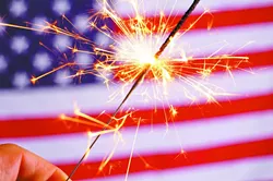 sparkler and usa flag showing 4th of july - BIGSTOCK