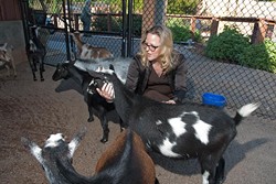 Louisa McCune-Elmore, executive director for the Kirkpatrick Foundation, with goats in the Children's Petting area at the Oklahoma City Zoo in this 1012 file photo.  mh