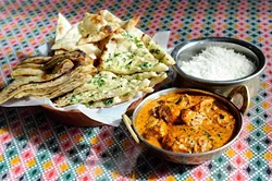 Chicken madras with bread basket at Mt. Everest Cuisines in Edmond, Tuesday, Feb. 9, 2016. - GARETT FISBECK