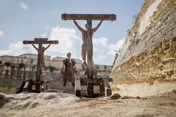 Jesus crucified along with other convicted criminals in Columbia Pictures' Risen. (CTMG / Rosie Collins / Provided)