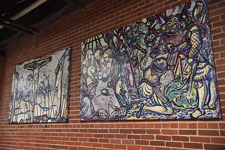 Artwork by Werner Ritter with a violent visual message, hanging in the lunchroom at City Rescue Mission, 10-8-15. - MARK HANCOCK