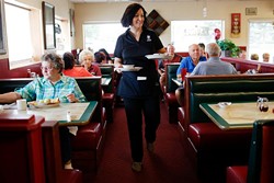 Tara Shorter serves patrons at Lola's Family Restaurant. (Garett Fisbeck)