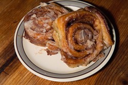 Two Cinnamon rolls are part of the "Kendall's Chicken Fry Challenge."