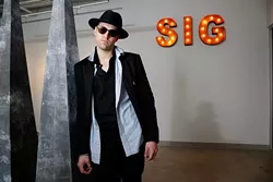 Steven Battles poses for a photo at SIG Art Gallery in Oklahoma City, Friday, May 15, 2015. - GARETT FISBECK