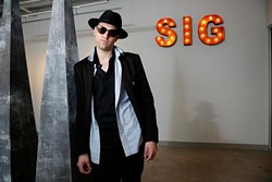 Steven Battles poses for a photo at SIG Art Gallery in Oklahoma City, Friday, May 15, 2015. - GARETT FISBECK