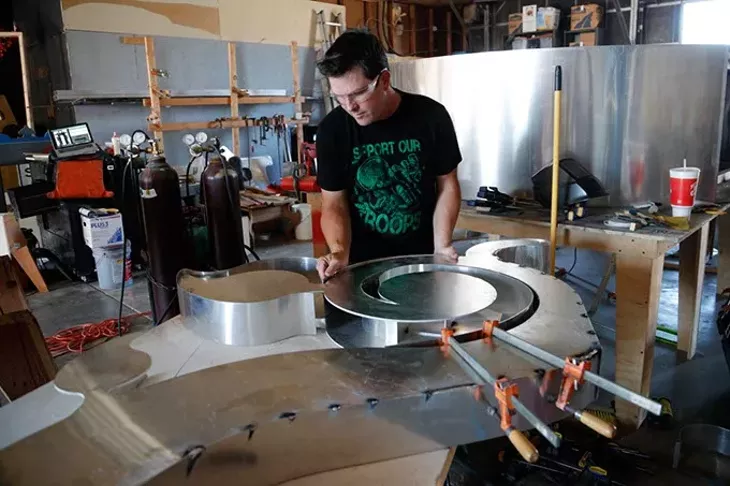 Hugh Meade works on a sculpture at his studio in Oklahoma City, Tuesday, Sept. 15, 2015. - GARETT FISBECK
