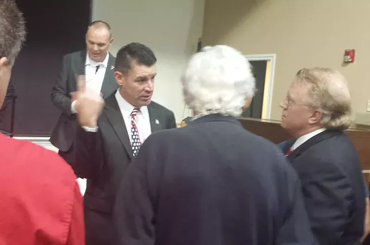 Rep. John Bennett, who has called Islam a "cancer" that needs to be removed, spoke with members of the audience following an anti-Islam event in Edmond on Oct. 13. - BEN FELDER