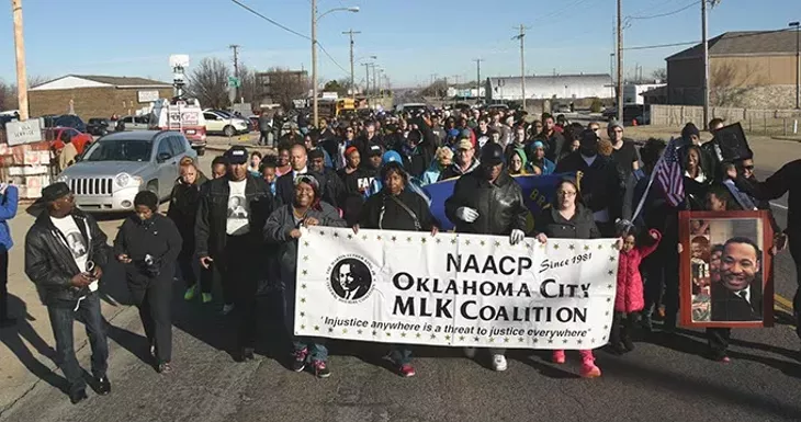 The "Silent March" makes it's way from the Freedom Center, 2609 N. Martin Luther King Avenue, Monday morning, marking MLK Day on the way to the State Capitol. mh