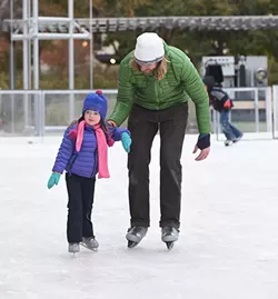 Students with their parants from the John W. Rex Downtown Elementary School, enjoy the Devon Ice Rink at the Myriad Botanical Gardens, 11-12-14. mh